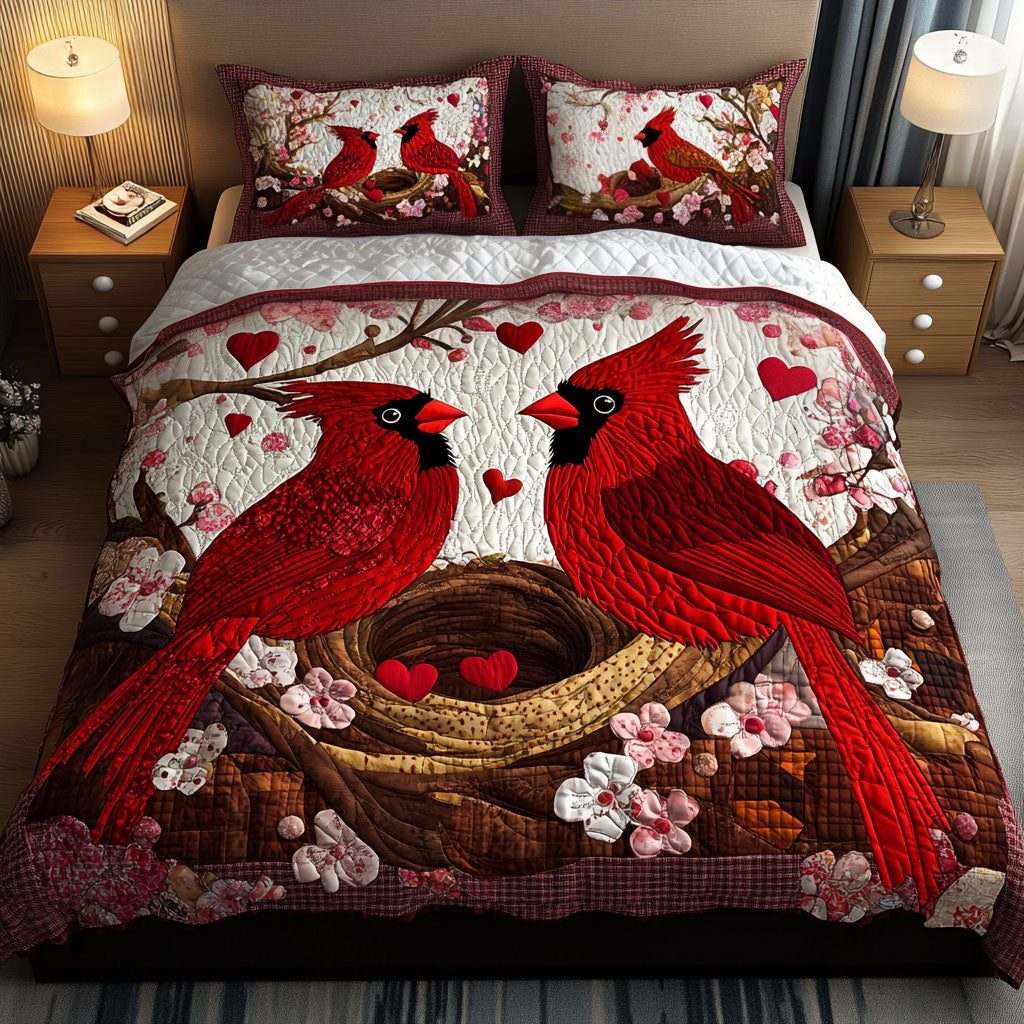 Love Nest quilted 3-piece bedding set on a made bed with two matching pillow shams