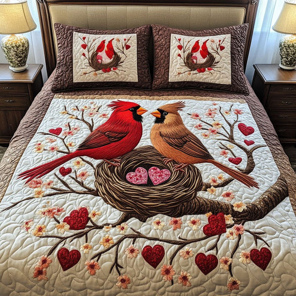 Love Perch quilted 3-piece bedding set on a made bed with two matching pillow shams
