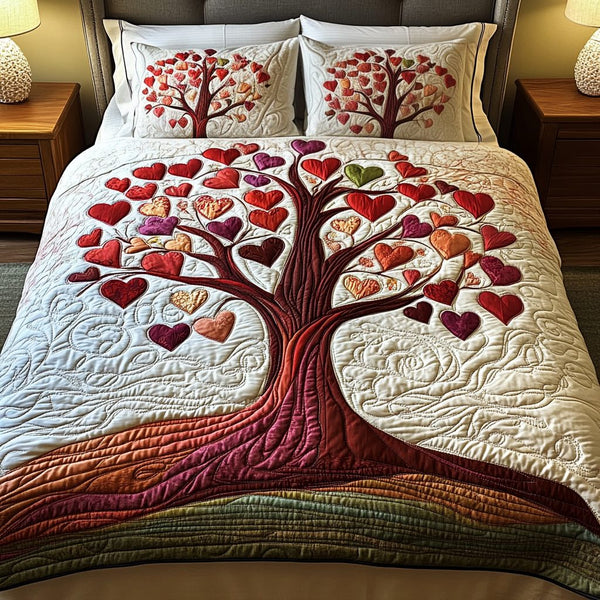 Love Roots quilted 3-piece bedding set on a made bed with two matching pillow shams