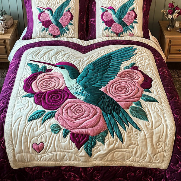 Love Wings quilted 3-piece bedding set on a made bed with two matching pillow shams