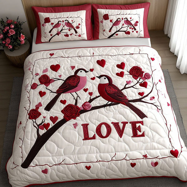 Lovebirds Forever quilted 3-piece bedding set on a made bed with two matching pillow shams
