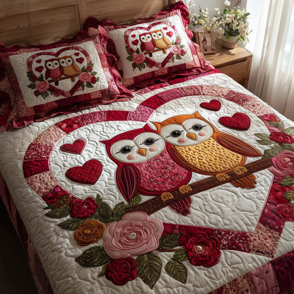 Lovebound Hearts quilted 3-piece bedding set on a made bed with two matching pillow shams