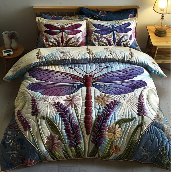 Lovely Dragonfly quilted 3-piece bedding set on a made bed with two matching pillow shams