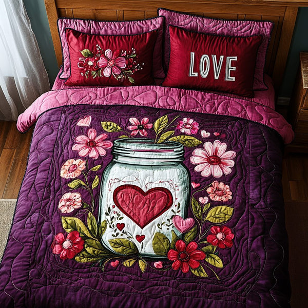 Loving Embrace quilted 3-piece bedding set on a made bed with two matching pillow shams