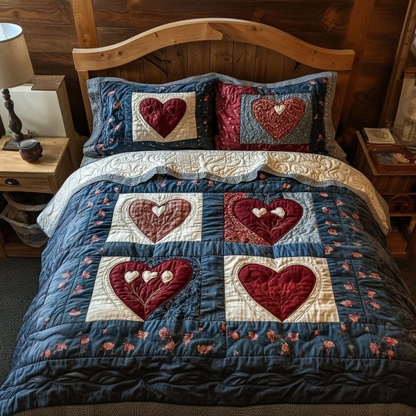 Loving Stitches quilted 3-piece bedding set on a made bed with two matching pillow shams
