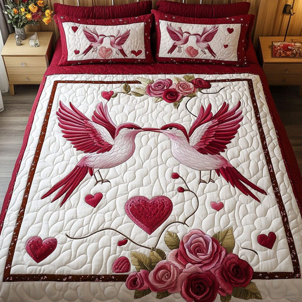 Loyal Hearts quilted 3-piece bedding set on a made bed with two matching pillow shams