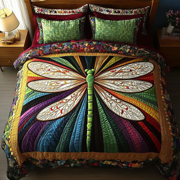 Luminous Flight quilted 3-piece bedding set on a made bed with two matching pillow shams