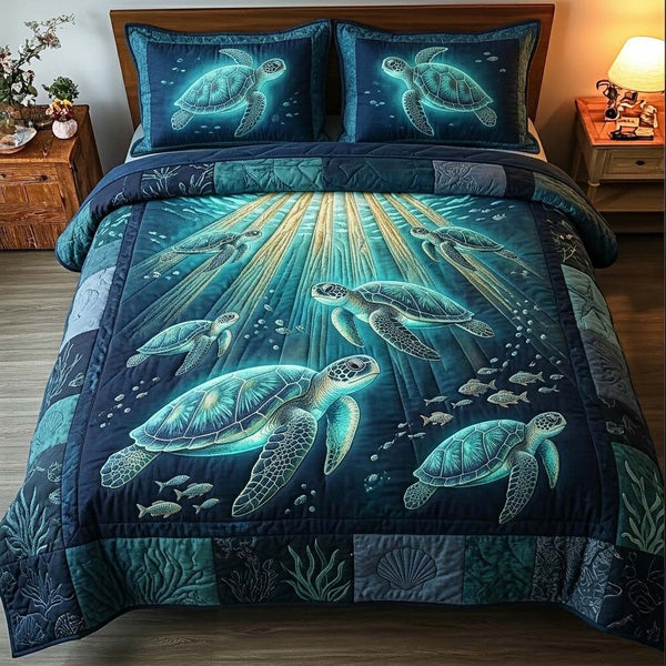 Luminous Sea Turtle quilted 3-piece bedding set on a made bed in a light coastal bedroom