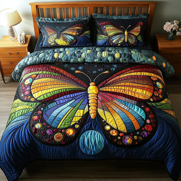 Luminous Wings quilted 3-piece bedding set on a made bed with two matching pillow shams