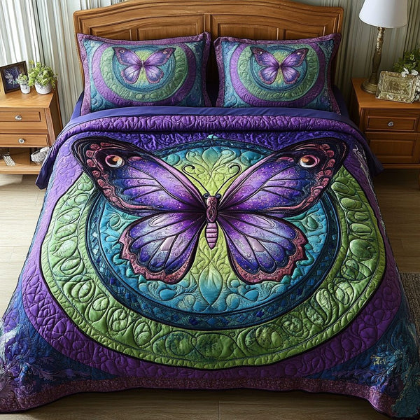 Luminous Wings quilted 3-piece bedding set on a made bed with two matching pillow shams