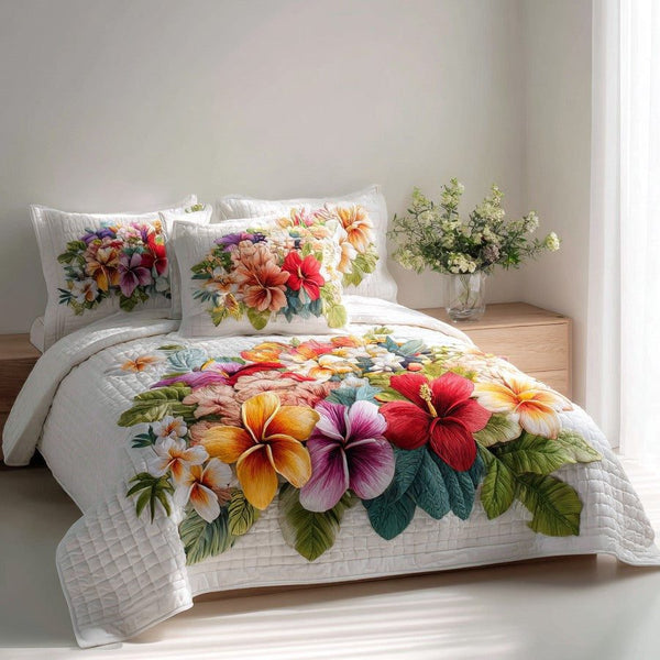 Lush Bouquet quilted 3-piece bedding set on a made bed with two matching pillow shams