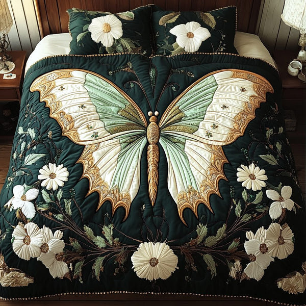 Lush Monarch quilted 3-piece bedding set on a made bed with two matching pillow shams