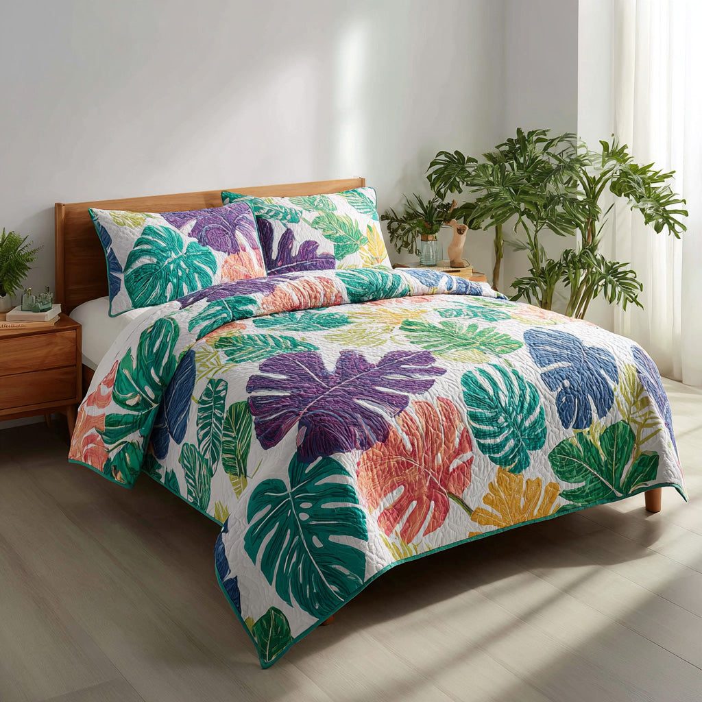 Lush Monstera quilted 3-piece bedding set on a made bed with two matching pillow shams