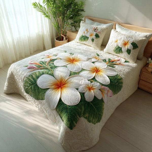 Lush Oasis quilted 3-piece bedding set on a made bed with two matching pillow shams