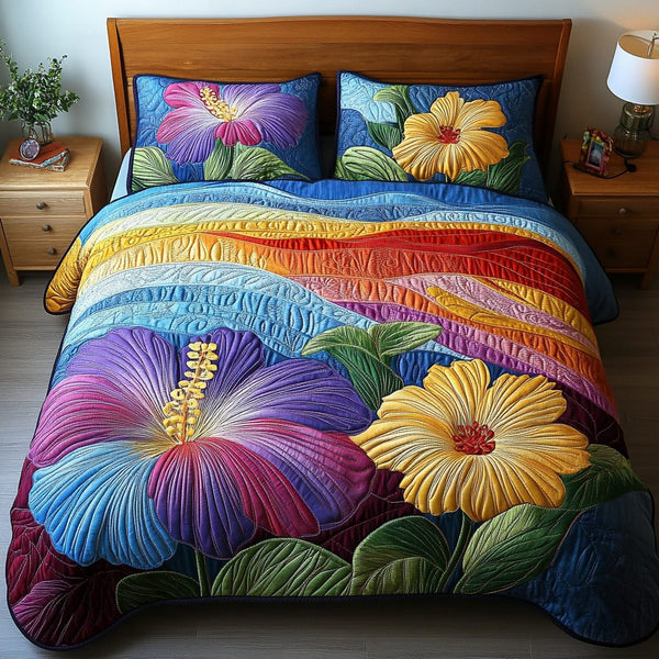 Lush Tropics quilted 3-piece bedding set on a made bed with two matching pillow shams