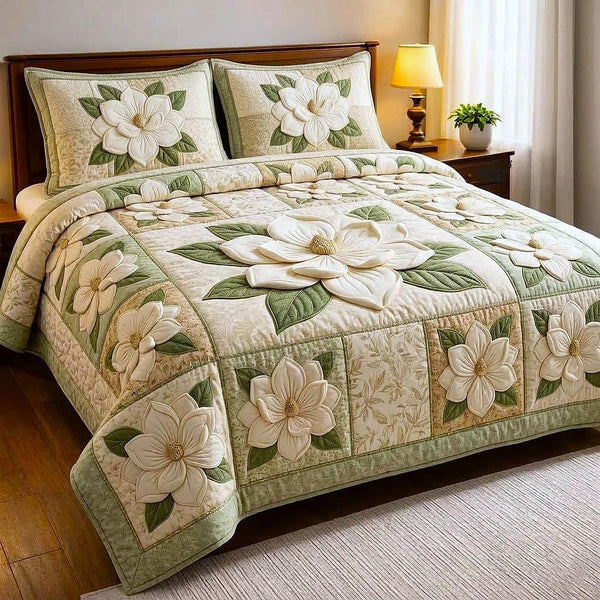 Magnolia Bloom quilted 3-piece bedding set on a made bed with two matching pillow shams