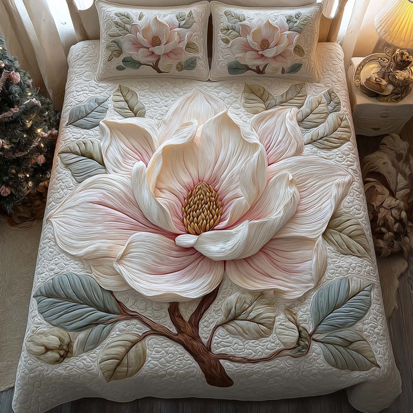 Magnolia Bloom quilted 3-piece bedding set on a made bed with two matching pillow shams