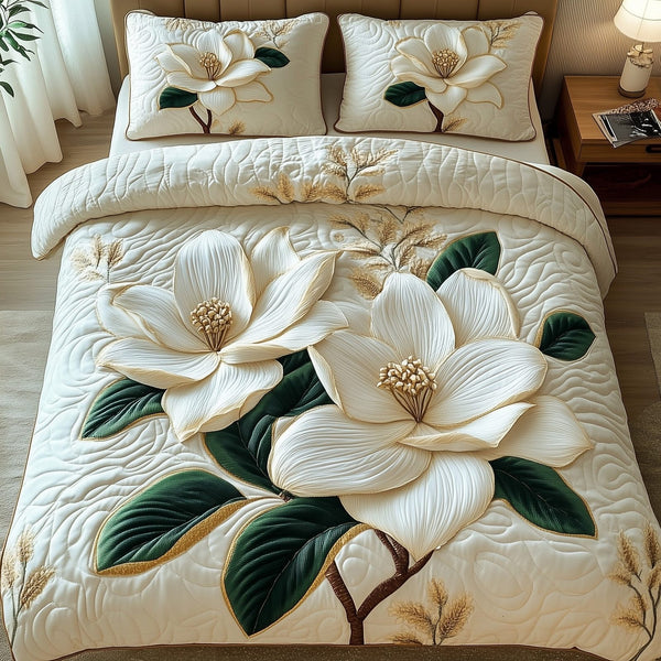 Magnolia Bloom quilted 3-piece bedding set on a made bed with two matching pillow shams