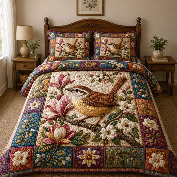 Magnolia Blossom Wren quilted 3-piece bedding set on a made bed with two matching pillow shams