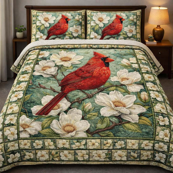 Magnolia Cardinal Grace quilted 3-piece bedding set on a made bed with two matching pillow shams