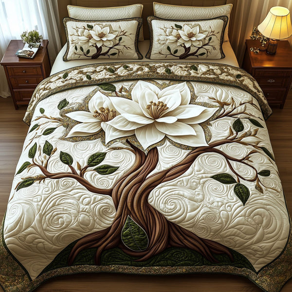 Magnolia Charm quilted 3-piece bedding set on a made bed with two matching pillow shams