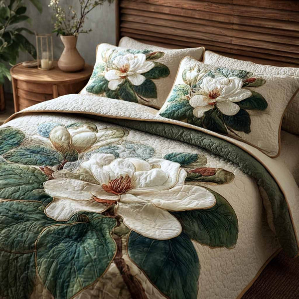 Magnolia Dream quilted 3-piece bedding set on a made bed with two matching pillow shams