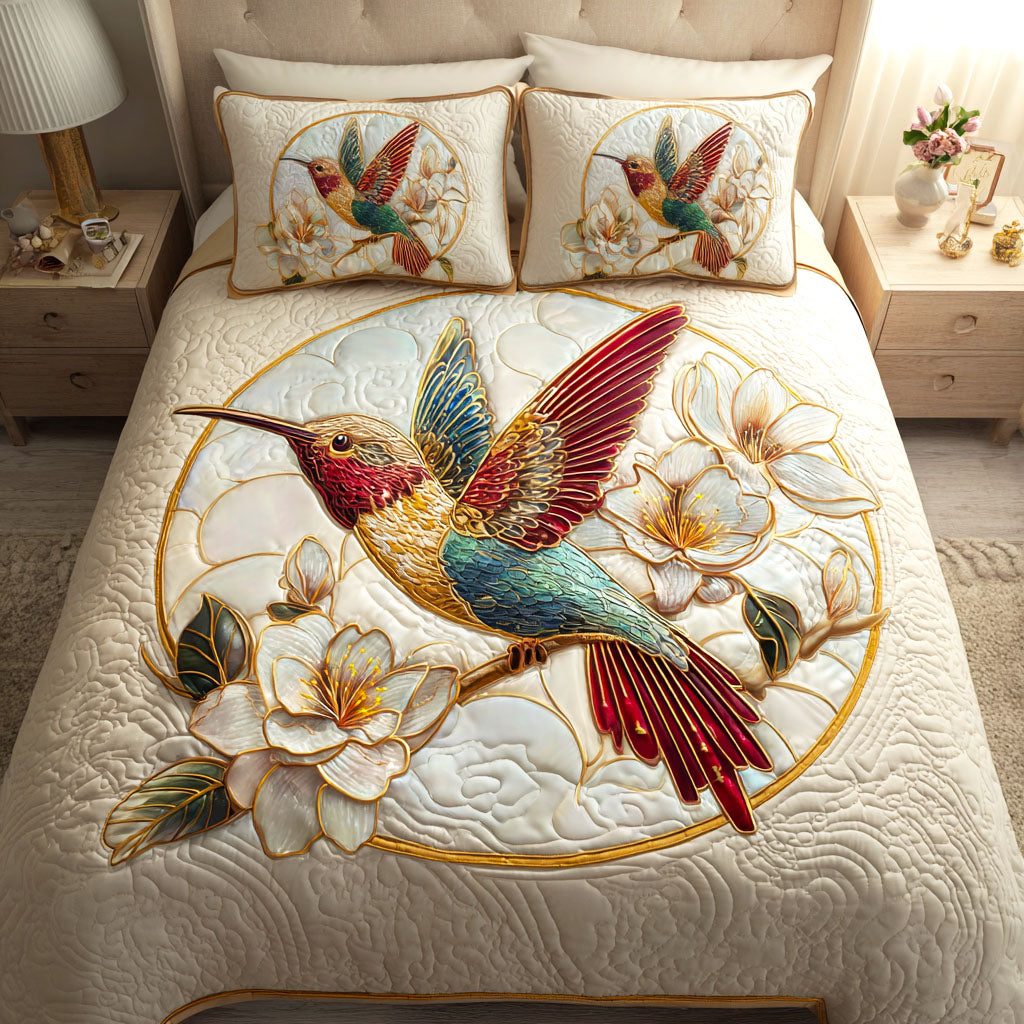 Magnolia Hover quilted 3-piece bedding set on a made bed with two matching pillow shams