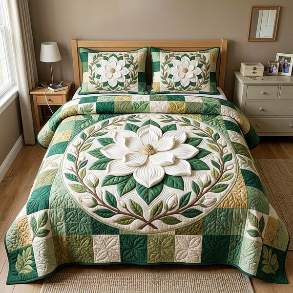 Magnolia Medallion quilted 3-piece bedding set on a made bed with two matching pillow shams