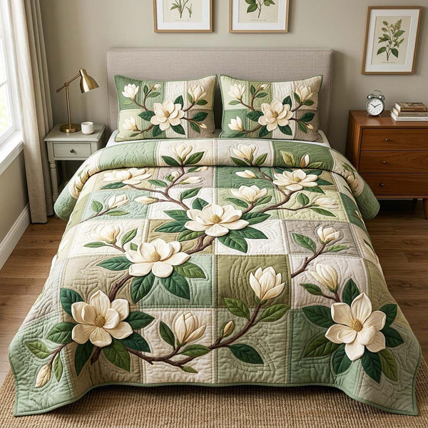 Magnolia Patch Garden quilted 3-piece bedding set on a made bed with two matching pillow shams