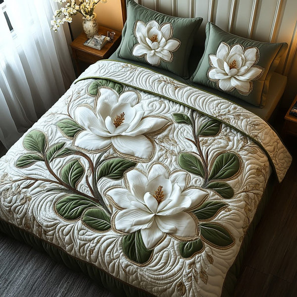 Magnolia quilted 3-piece bedding set on a made bed with two matching pillow shams