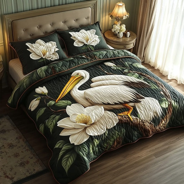 Magnolia Waters quilted 3-piece bedding set on a made bed with two matching pillow shams