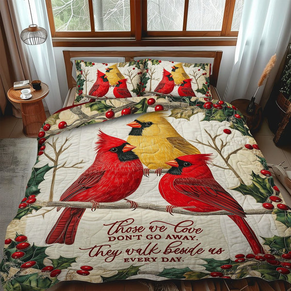 Majestic Cardinals quilted 3-piece bedding set on a made bed with two matching pillow shams