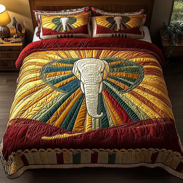 Majestic Elephant quilted 3-piece bedding set on a made bed with two matching pillow shams