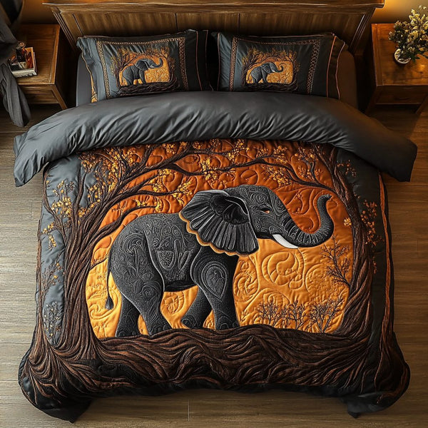 Majestic Elephant quilted 3-piece bedding set on a made bed with two matching pillow shams