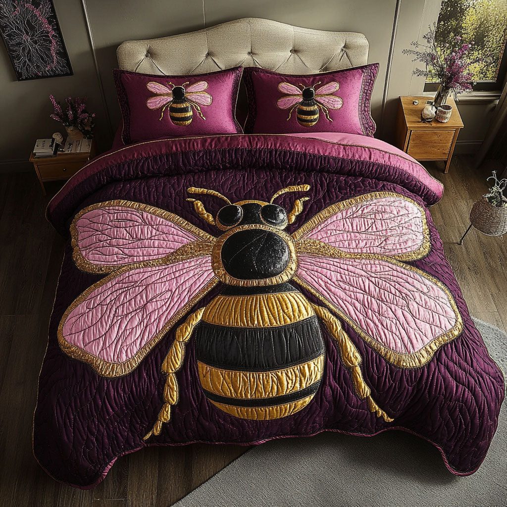 Majestic Pink Bee quilted 3-piece bedding set on a made bed with two matching pillow shams