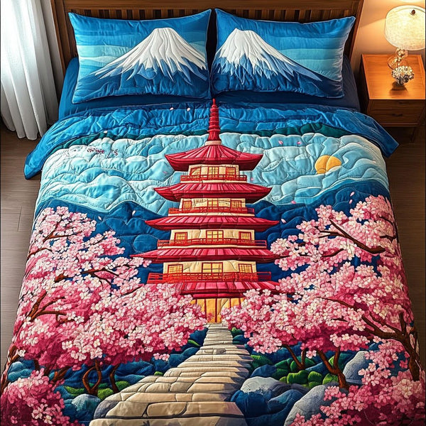 Majestic Sakura quilted 3-piece bedding set on a made bed with two matching pillow shams