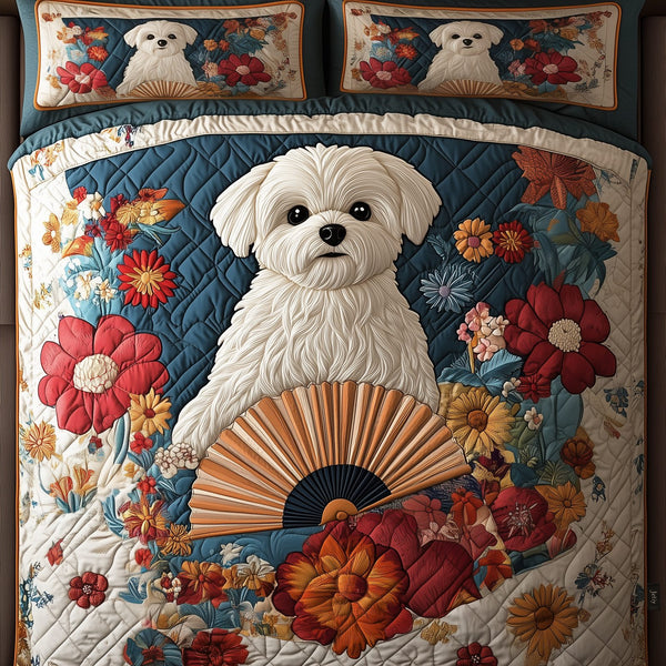 Maltese quilted 3-piece bedding set on a made bed with two matching pillow shams