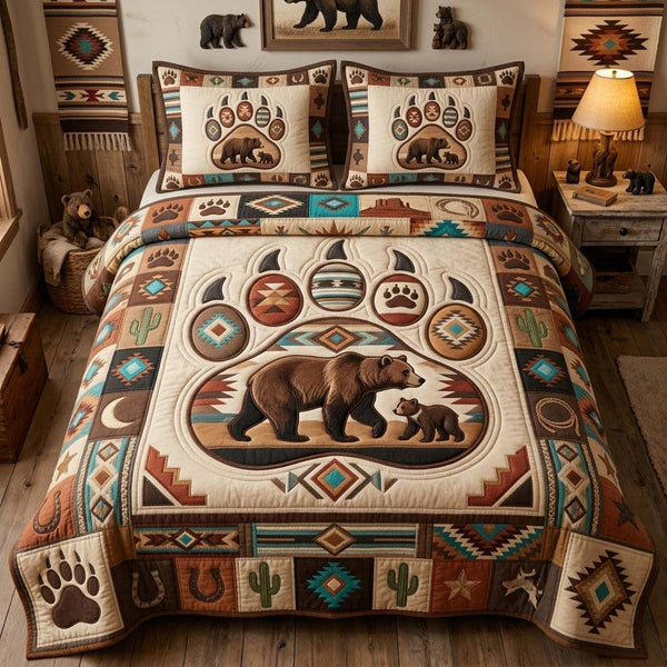 Mama Bear Trail quilted 3-piece bedding set on a made bed with two matching pillow shams