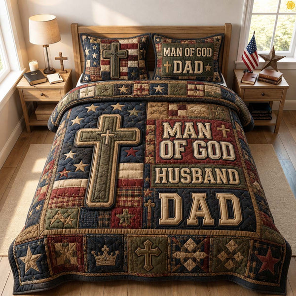 Man Of God Dad quilted 3-piece bedding set on a made bed in a softly lit bedroom