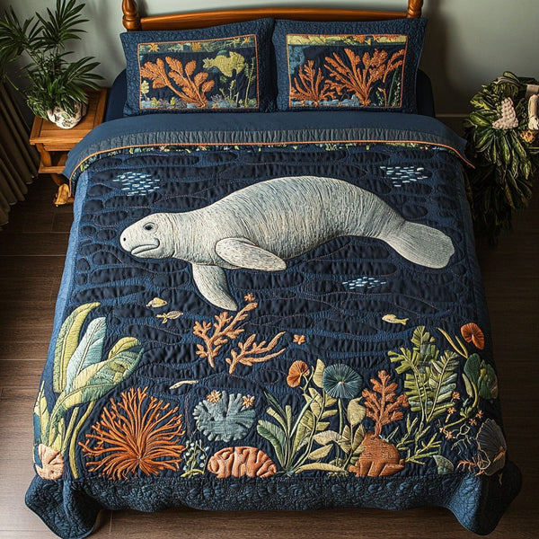 Manatee Dreamscape quilted 3-piece bedding set on a made bed with two matching pillow shams
