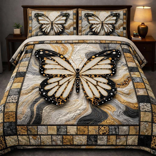 Marble Monarch Elegance quilted 3-piece bedding set on a made bed with two matching pillow shams