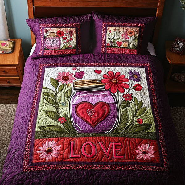 Mason Jar Love quilted 3-piece bedding set on a made bed with two matching pillow shams