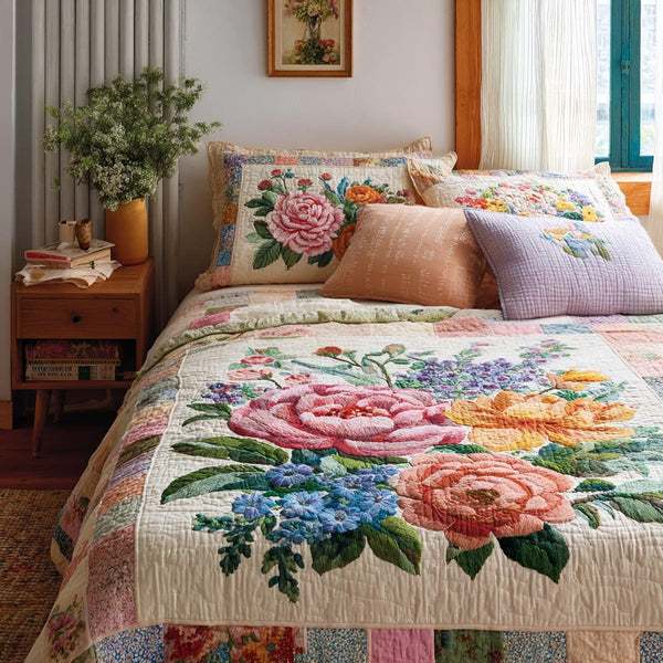 Meadow Bloom quilted 3-piece bedding set on a made bed with two matching pillow shams