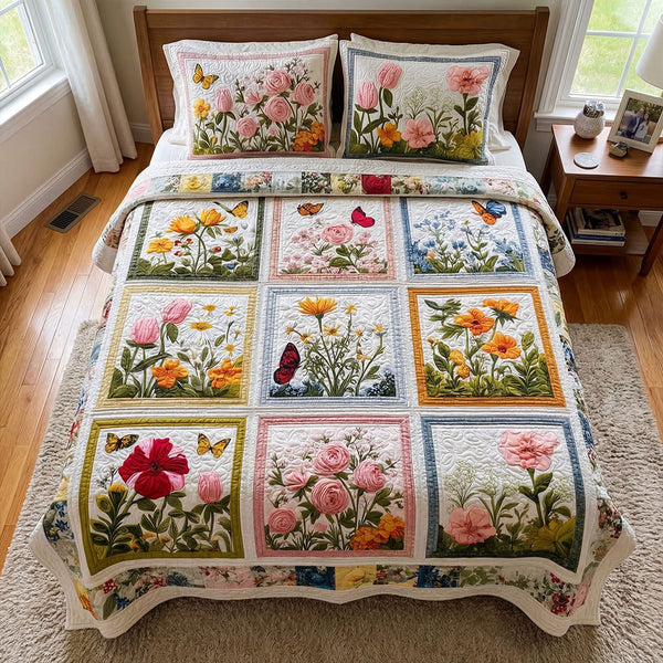 Meadow Blossom Retreat quilted 3-piece bedding set on a made bed with two matching pillow shams