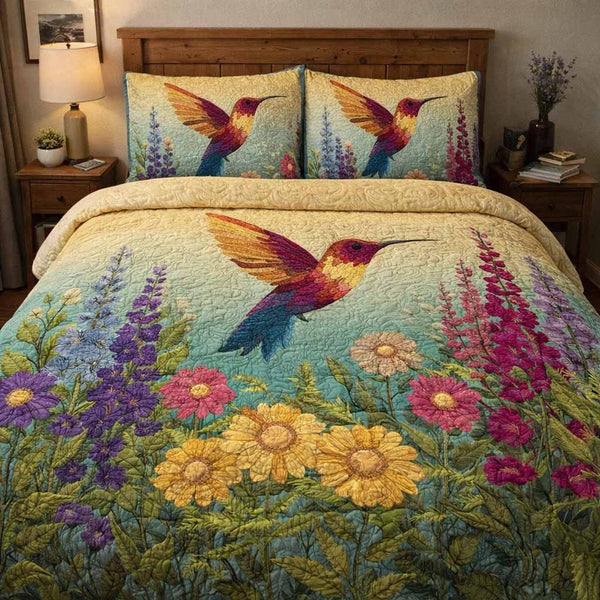 Meadow Flight quilted 3-piece bedding set on a made bed with two matching pillow shams