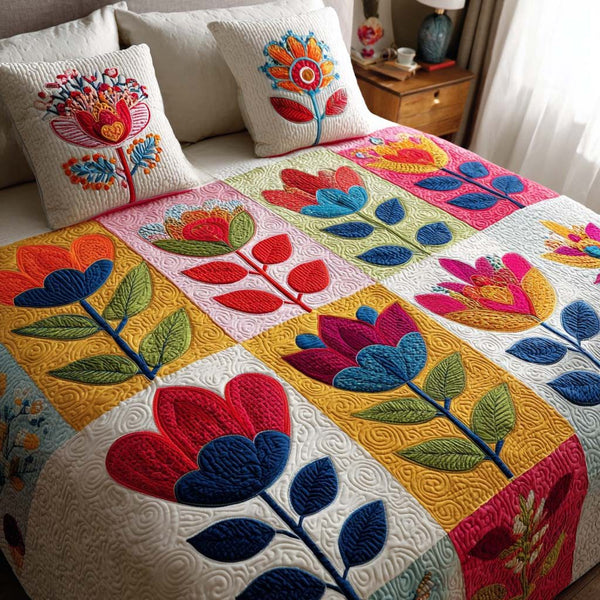 Meadow Grace quilted 3-piece bedding set on a made bed with two matching pillow shams