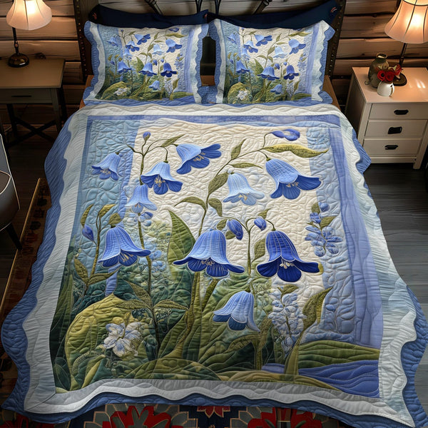 Meadow Tranquility quilted 3-piece bedding set on a made bed with two matching pillow shams