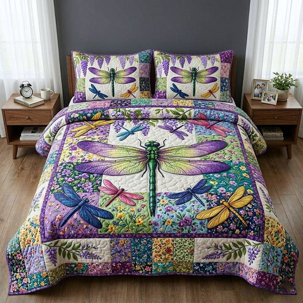 Meadow Wings quilted 3-piece bedding set on a made bed with two matching pillow shams