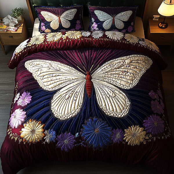 Meadow Wings quilted 3-piece bedding set on a made bed with two matching pillow shams