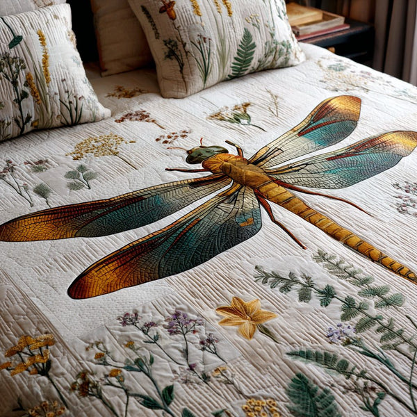 Meadow Wings quilted 3-piece bedding set on a made bed with two matching pillow shams
